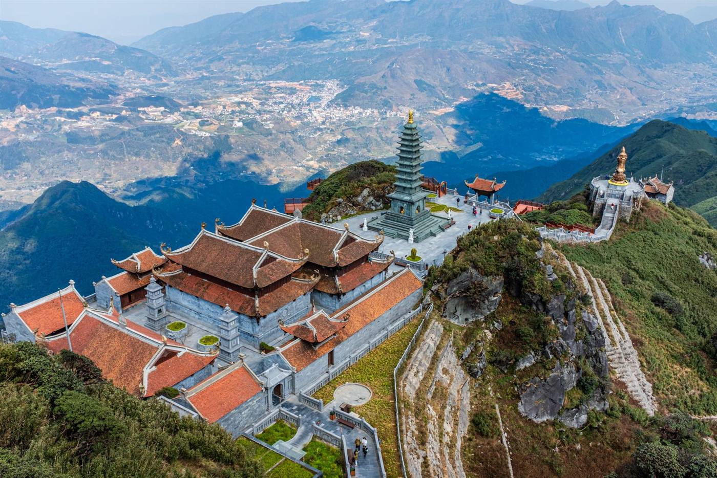 Temple complex on the summit of Fansipan above a sea of mountains in Sapa, Vietnam