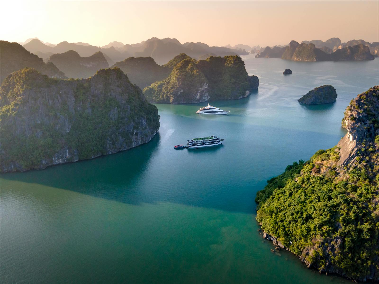 Cruise ship among the limestone islands of Ha Long Bay