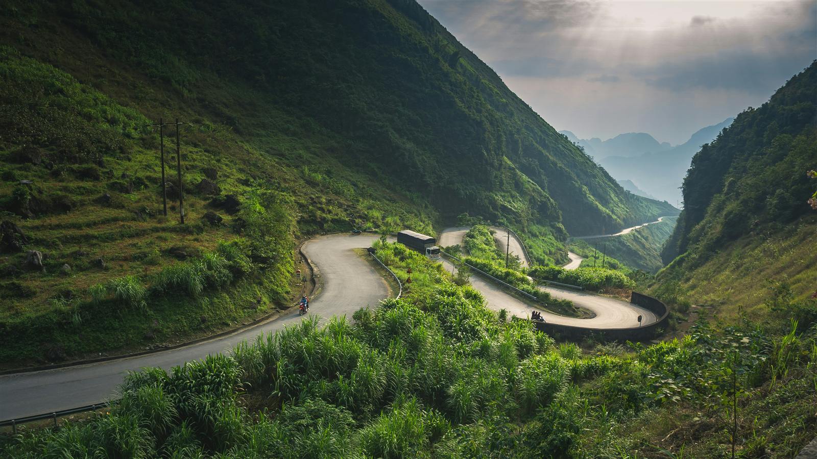 Motorbike road winding through the mountains of the Ha Giang Loop in Northern Vietnam
